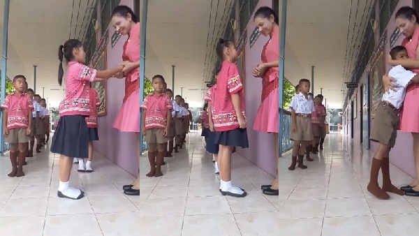 คุณครูให้เด็กสปีคอิงลิชก่อนเข้าเรียน